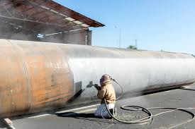 Sandblasting a pipe