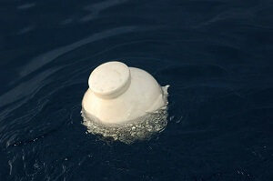 Urn With Ashes in Sea